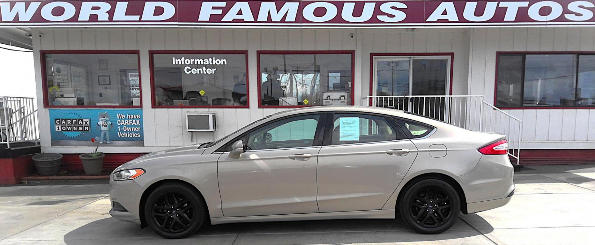 2015 GOLD Ford Fusion SE (3FA6P0H74FR) with an 2.5L L4 DOHC 16V engine, located at 502 S. Riverside Avenue, Medford, OR, 97501, (541) 773-3136, 42.322803, -122.867477 - Photo#0