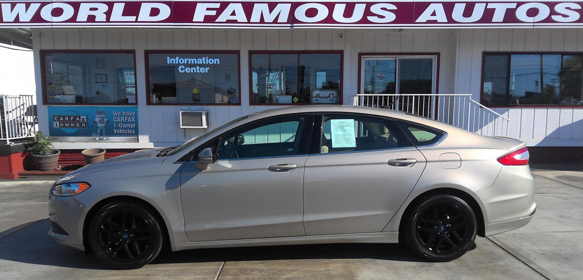 2015 GOLD Ford Fusion SE (3FA6P0H74FR) with an 2.5L L4 DOHC 16V engine, located at 502 S. Riverside Avenue, Medford, OR, 97501, (541) 773-3136, 42.322803, -122.867477 - Photo#0