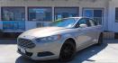 2015 GOLD Ford Fusion SE (3FA6P0H74FR) with an 2.5L L4 DOHC 16V engine, located at 502 S. Riverside Avenue, Medford, OR, 97501, (541) 773-3136, 42.322803, -122.867477 - Photo#1