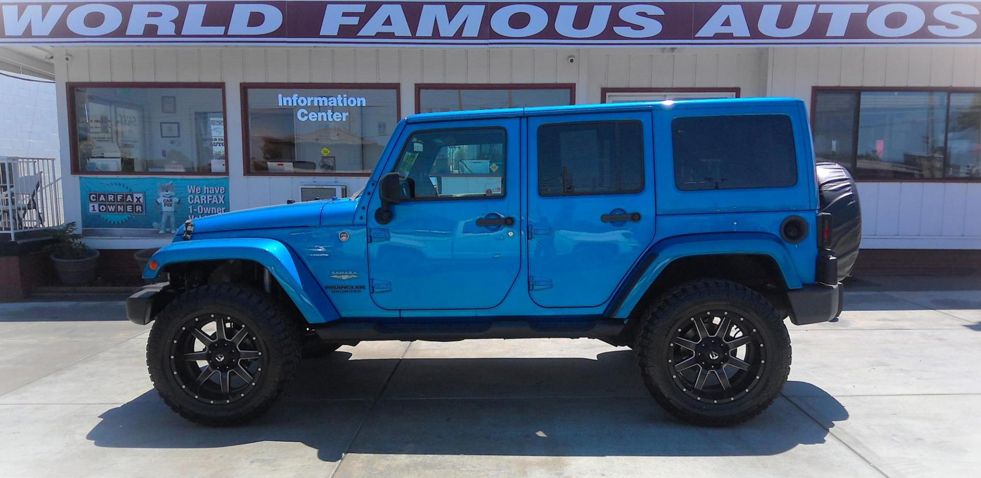 2014 BLUE Jeep Wrangler Unlimited Sahara 4WD (1C4BJWEG9EL) with an 3.6L V6 DOHC 24V FFV engine, located at 502 S. Riverside Avenue, Medford, OR, 97501, (541) 773-3136, 42.322803, -122.867477 - Photo#0