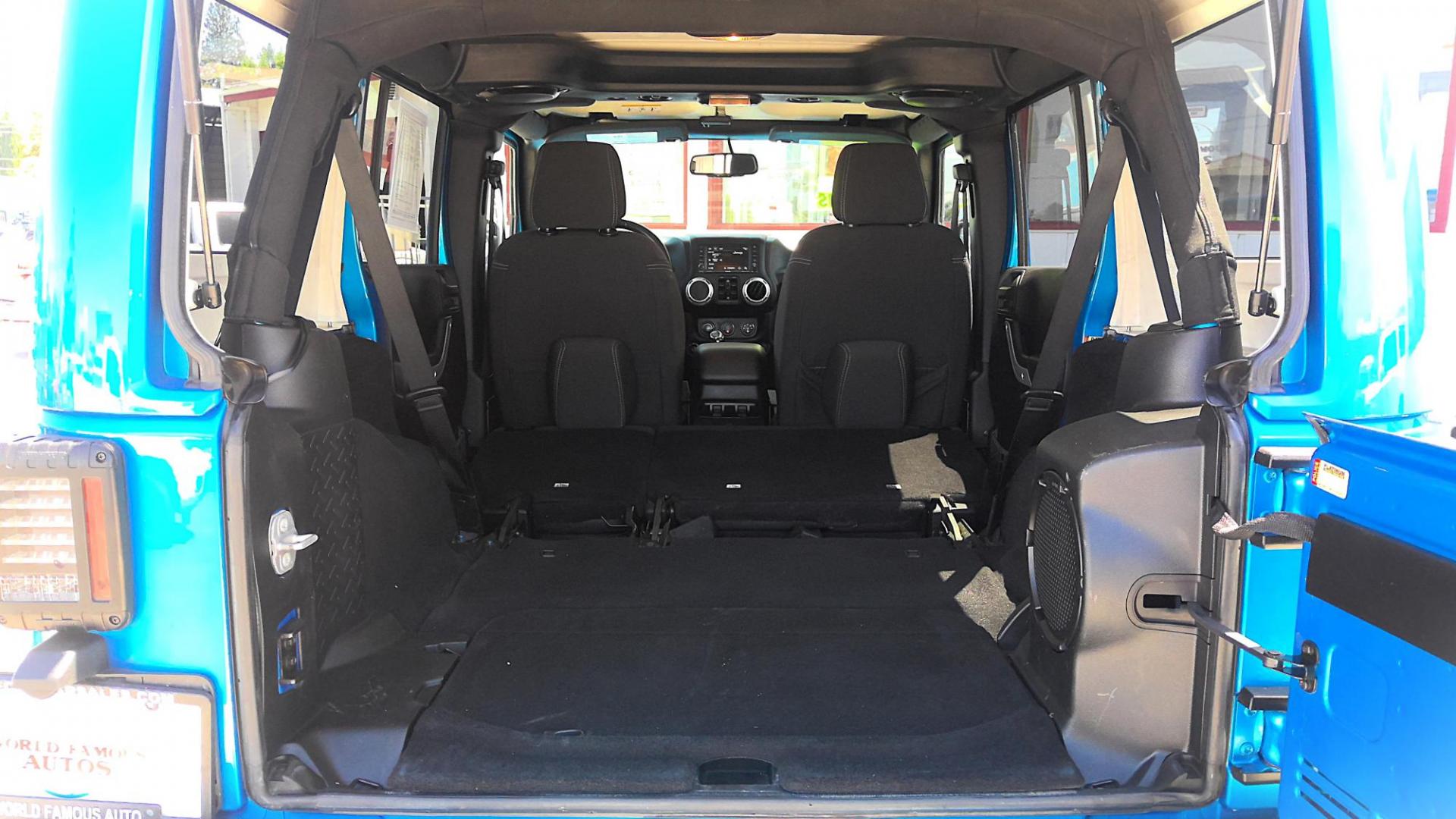 2014 BLUE Jeep Wrangler Unlimited Sahara 4WD (1C4BJWEG9EL) with an 3.6L V6 DOHC 24V FFV engine, located at 502 S. Riverside Avenue, Medford, OR, 97501, (541) 773-3136, 42.322803, -122.867477 - Photo#5