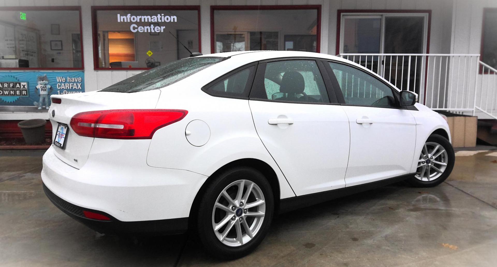 2017 WHITE Ford Focus SE Sedan (1FADP3F29HL) with an 2.0L L4 DOHC 16V engine, located at 502 S. Riverside Avenue, Medford, OR, 97501, (541) 773-3136, 42.322803, -122.867477 - Photo#2