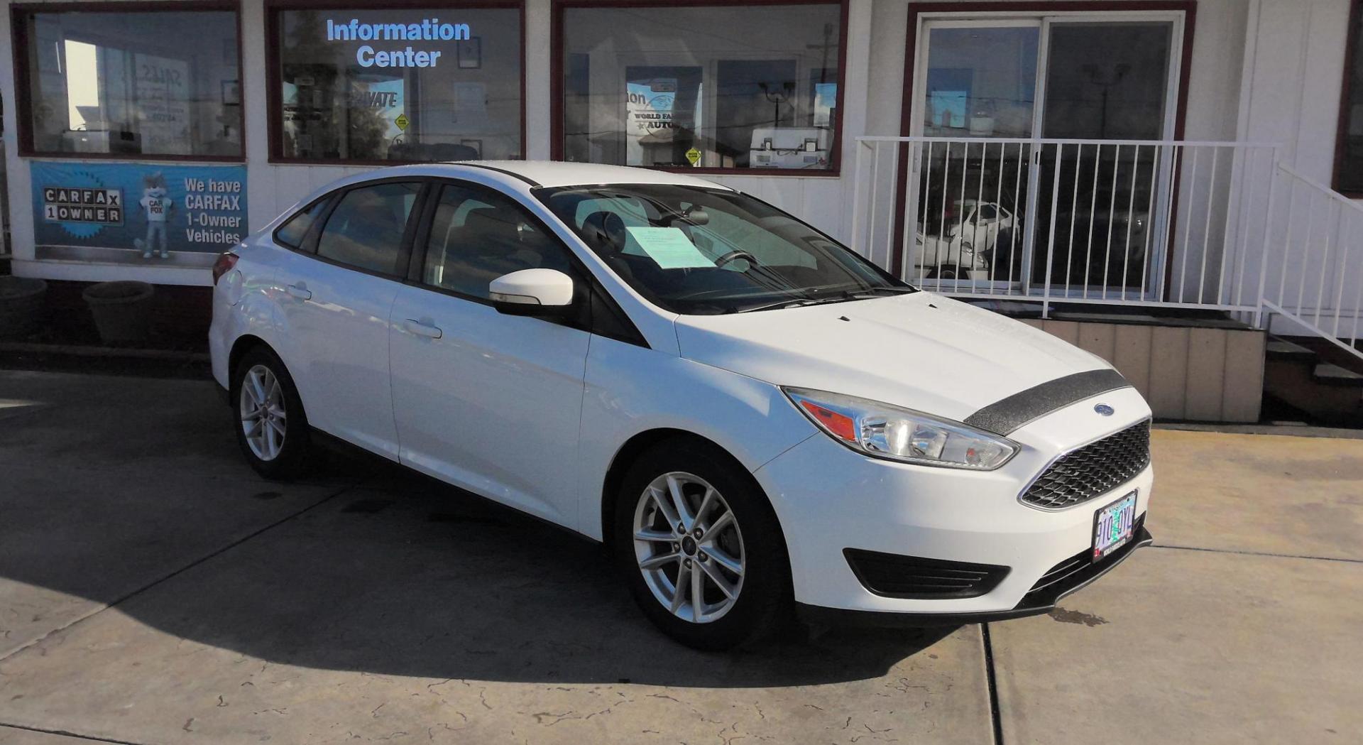 2017 WHITE Ford Focus SE Sedan (1FADP3F29HL) with an 2.0L L4 DOHC 16V engine, located at 502 S. Riverside Avenue, Medford, OR, 97501, (541) 773-3136, 42.322803, -122.867477 - Photo#1