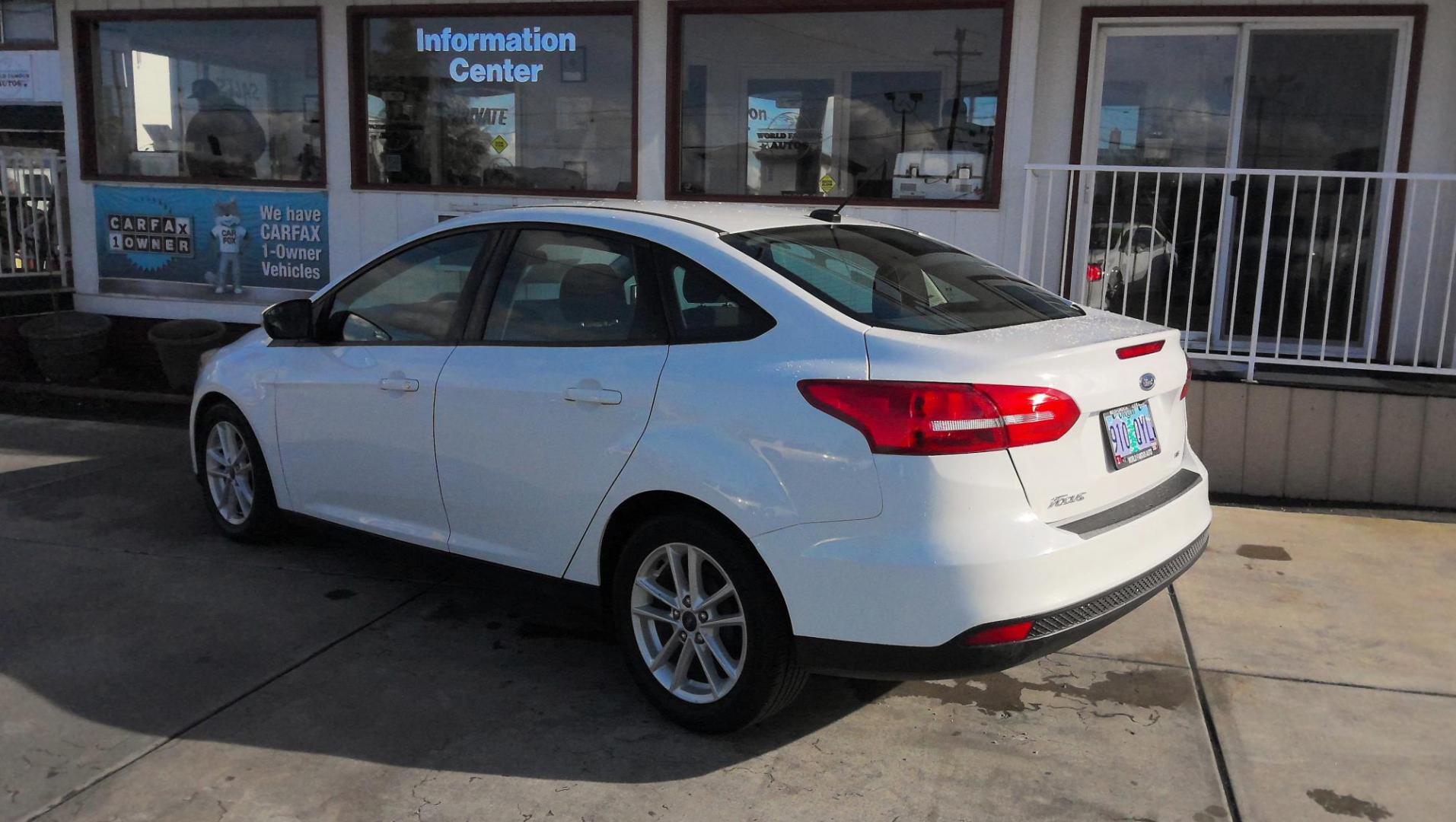 2017 WHITE Ford Focus SE Sedan (1FADP3F29HL) with an 2.0L L4 DOHC 16V engine, located at 502 S. Riverside Avenue, Medford, OR, 97501, (541) 773-3136, 42.322803, -122.867477 - Photo#2