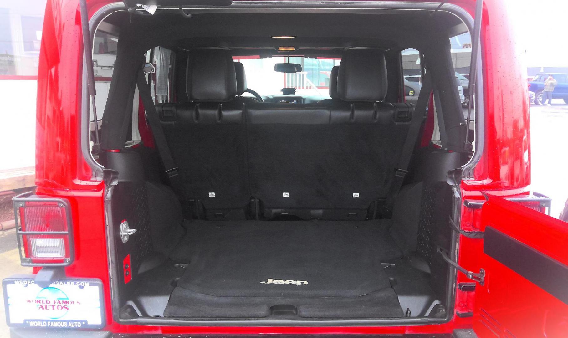 2015 RED Jeep Wrangler Unlimited Sahara 4WD (1C4HJWEG1FL) with an 3.6L V6 DOHC 24V FFV engine, located at 502 S. Riverside Avenue, Medford, OR, 97501, (541) 773-3136, 42.322803, -122.867477 - Photo#3