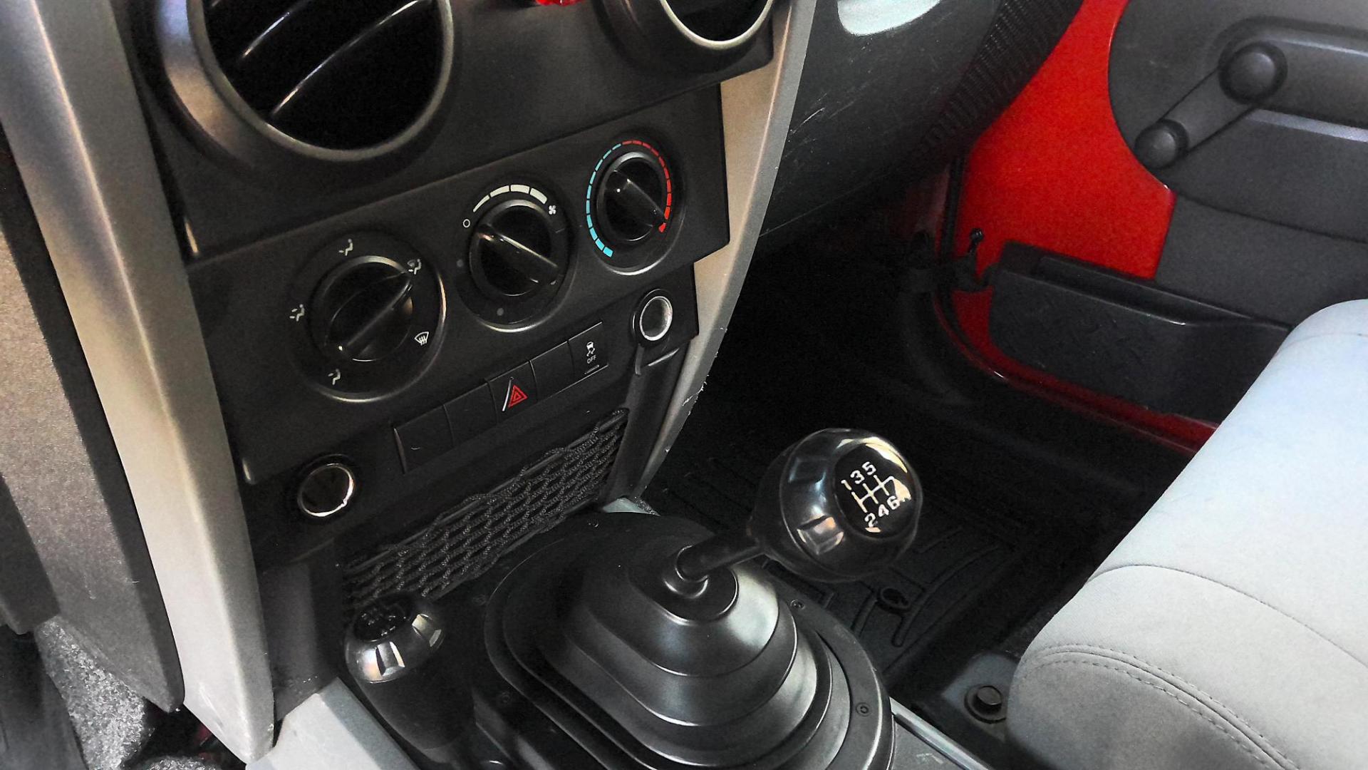 2010 RED Jeep Wrangler Sport 4WD (1J4AA2D14AL) with an 3.8L V6 OHV 12V engine, located at 502 S. Riverside Avenue, Medford, OR, 97501, (541) 773-3136, 42.322803, -122.867477 - Photo#7