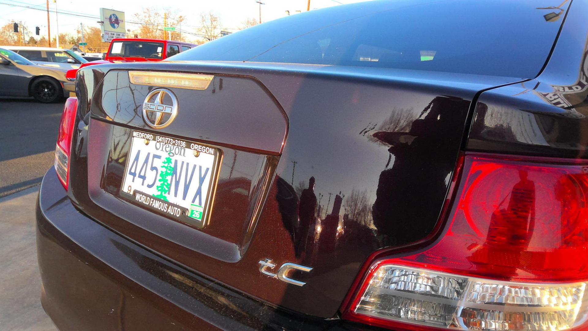 2012 MAROON Scion tC Sports Coupe 6-Spd AT (JTKJF5C76C3) with an 2.4L L4 DOHC 16V engine, 6-Speed Automatic transmission, located at 502 S. Riverside Avenue, Medford, OR, 97501, (541) 773-3136, 42.322803, -122.867477 - Photo#3