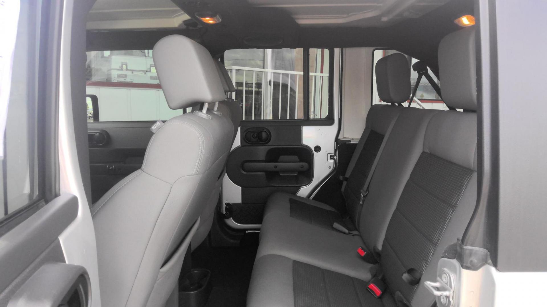 2010 SILVER Jeep Wrangler Unlimited Sport 4WD (1J4HA3H15AL) with an 3.8L V6 OHV 12V engine, located at 502 S. Riverside Avenue, Medford, OR, 97501, (541) 773-3136, 42.322803, -122.867477 - Photo#4