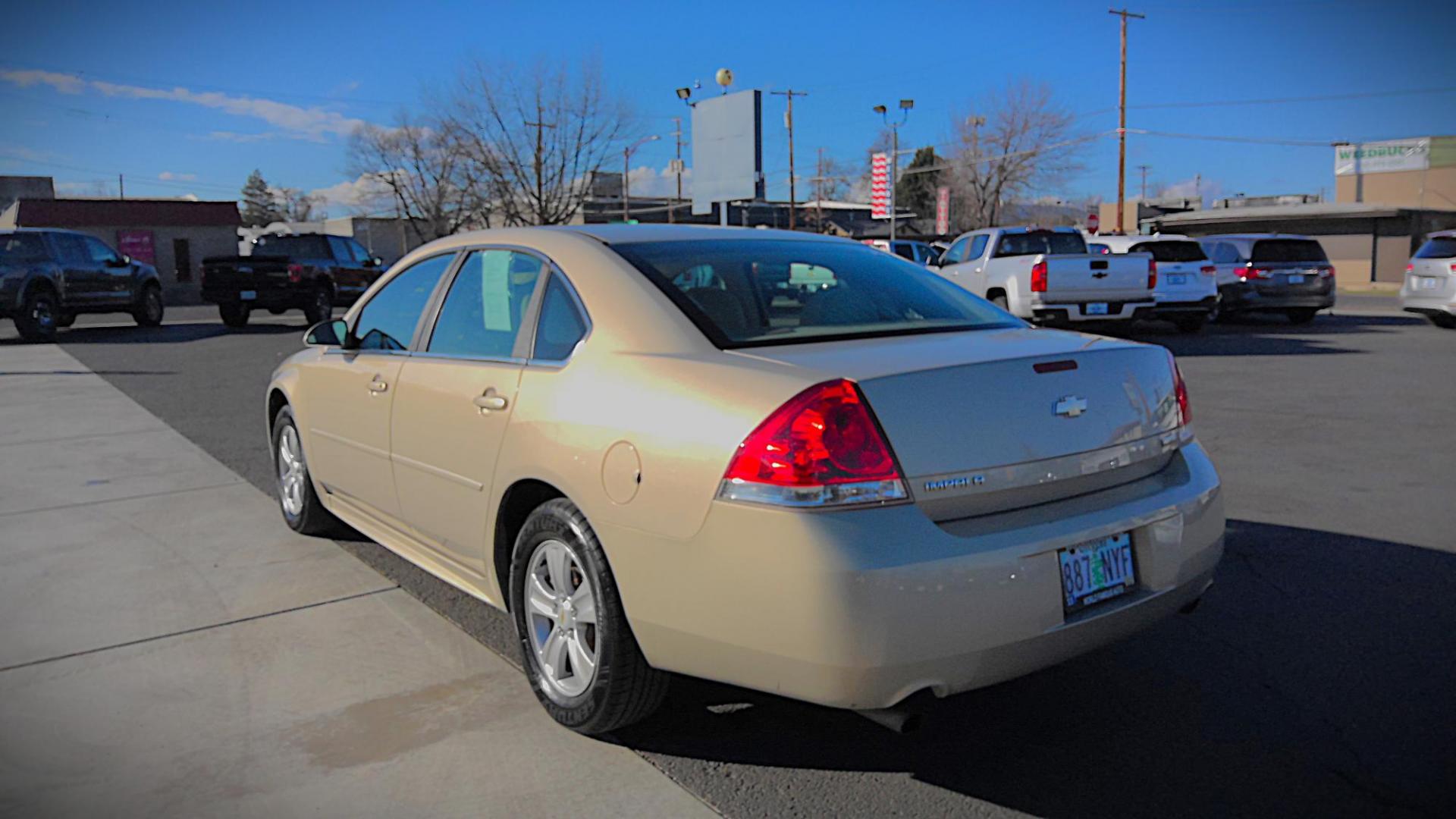 2012 GOLD Chevrolet Impala LS (Fleet) (2G1WF5E3XC1) with an 3.6L V6 DOHC 16V FFV engine, 6-Speed Automatic transmission, located at 502 S. Riverside Avenue, Medford, OR, 97501, (541) 773-3136, 42.322803, -122.867477 - Photo#2