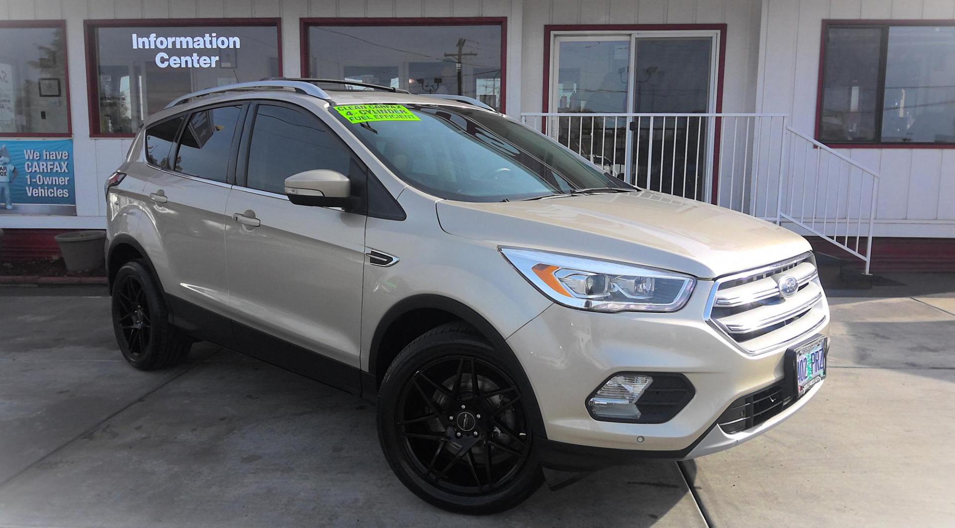 2018 GOLD Ford Escape Titanium 4WD (1FMCU9J96JU) with an 2.0L L4 DOHC 16V engine, 6A transmission, located at 502 S. Riverside Avenue, Medford, OR, 97501, (541) 773-3136, 42.322803, -122.867477 - Photo#1